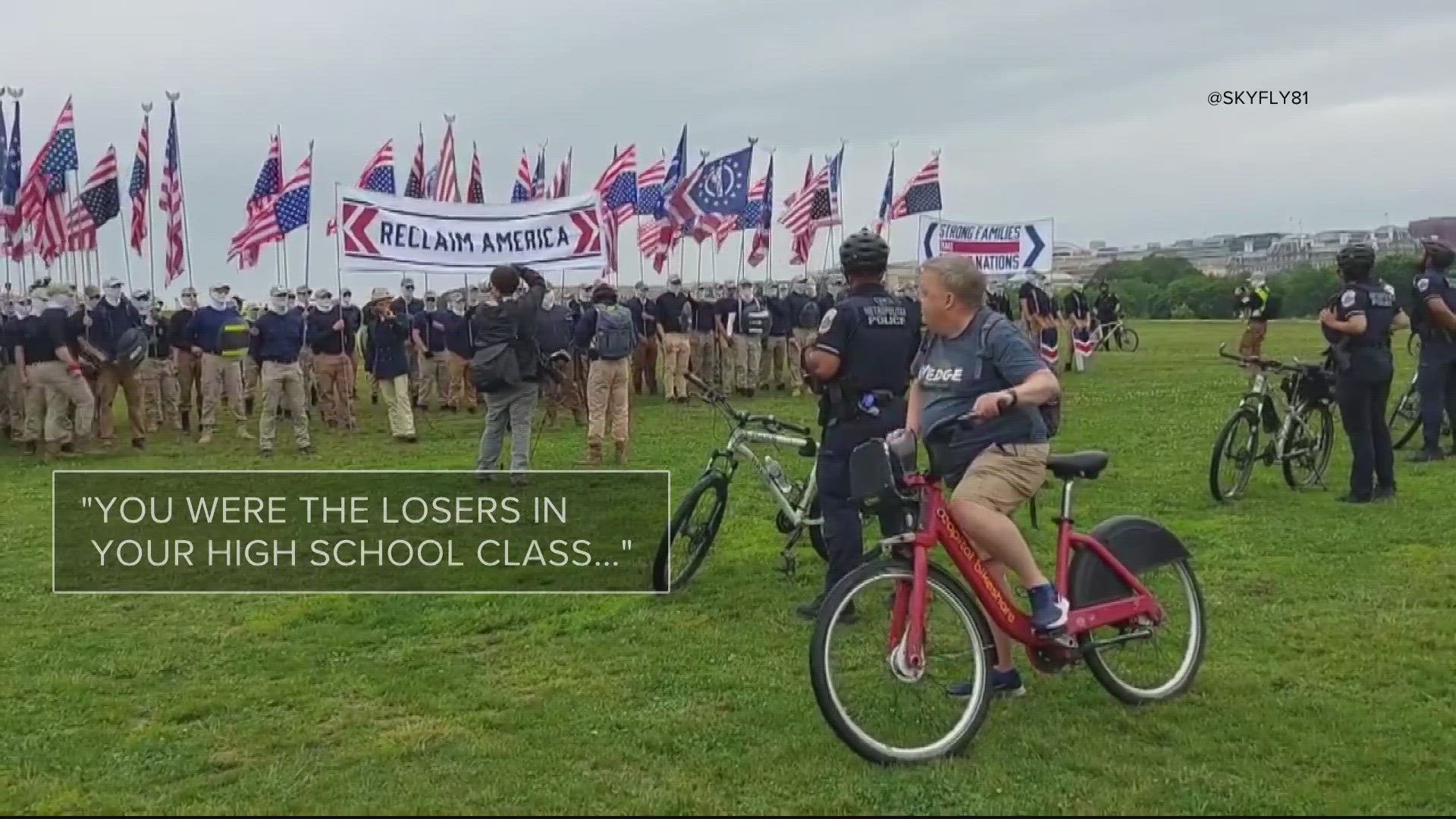 Patriot Front - a white supremacist group recognized by the Anti Defamation League and Southern Poverty Law Center. And a lone cyclist.
Taunting them.