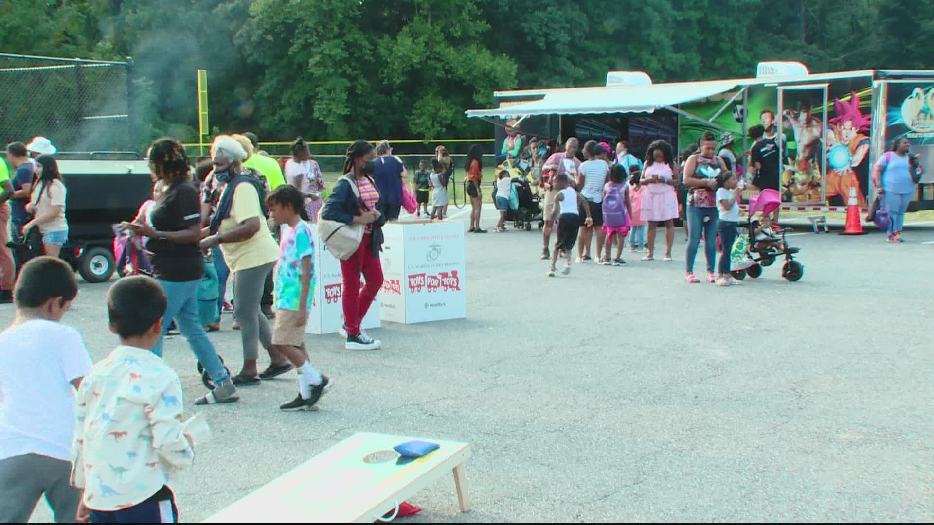 Officers gave away backpacks and other supplies to students in advance of the upcoming school year.