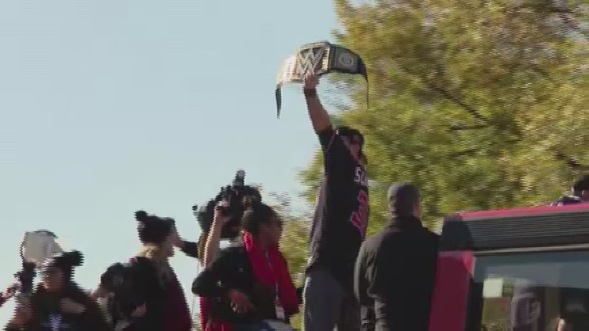 It's a WWE tradition for major sports league champions to receive a custom WWE Championship Title with the team's logo on it.