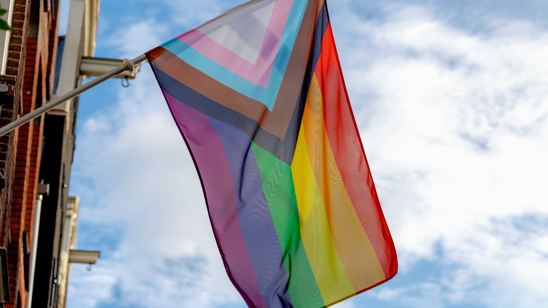 An arrest has been made after a person was caught trying to cut down a Pride flag in Arlington Friday morning.