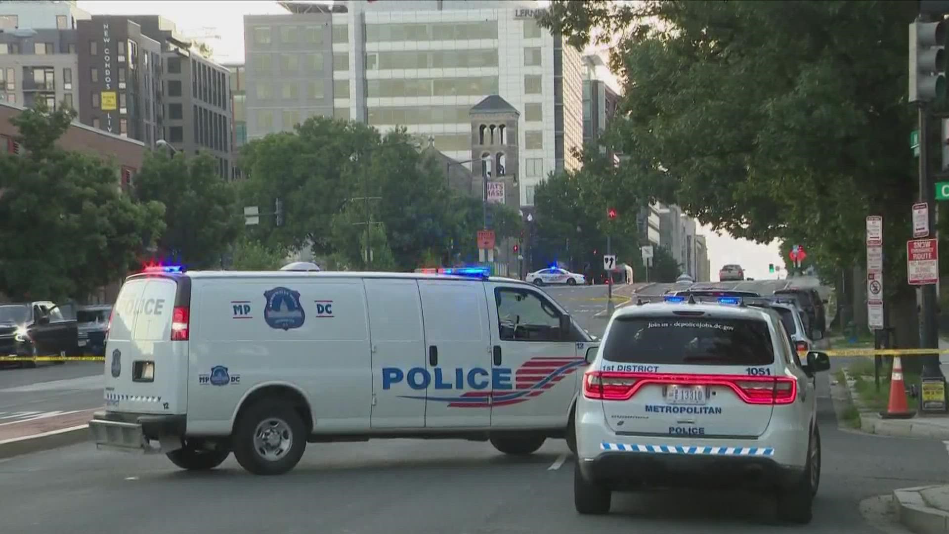 MPD officers have closed a portion of M Street Southwest to assist the DEA and the FBI in serving a warrant.