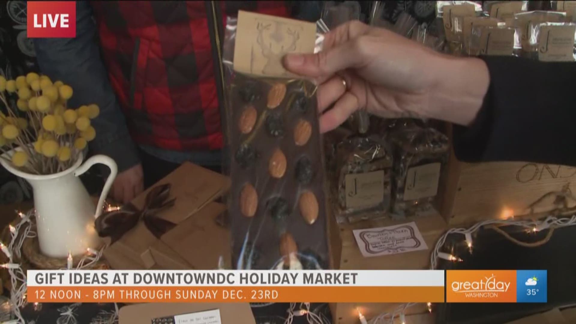 Jane Morris of J Chocolatier shows off her handcrafted chocolate bars available at the holiday market in downtown DC now till December 23.