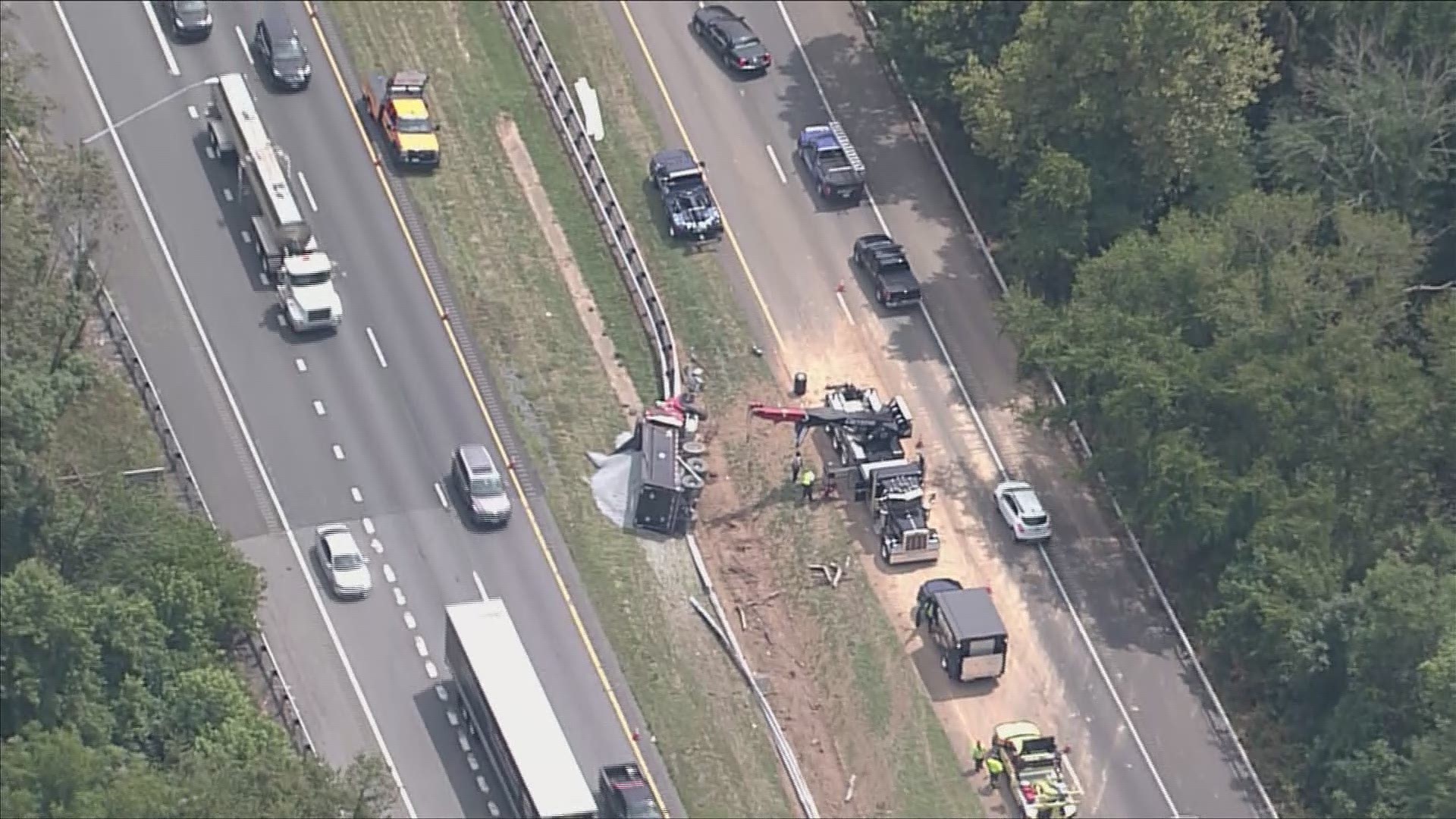 A dump trucked carrying stone overturned onto a median on Interstate 270 near Frederick, Md. Traffic is backed up for miles.
