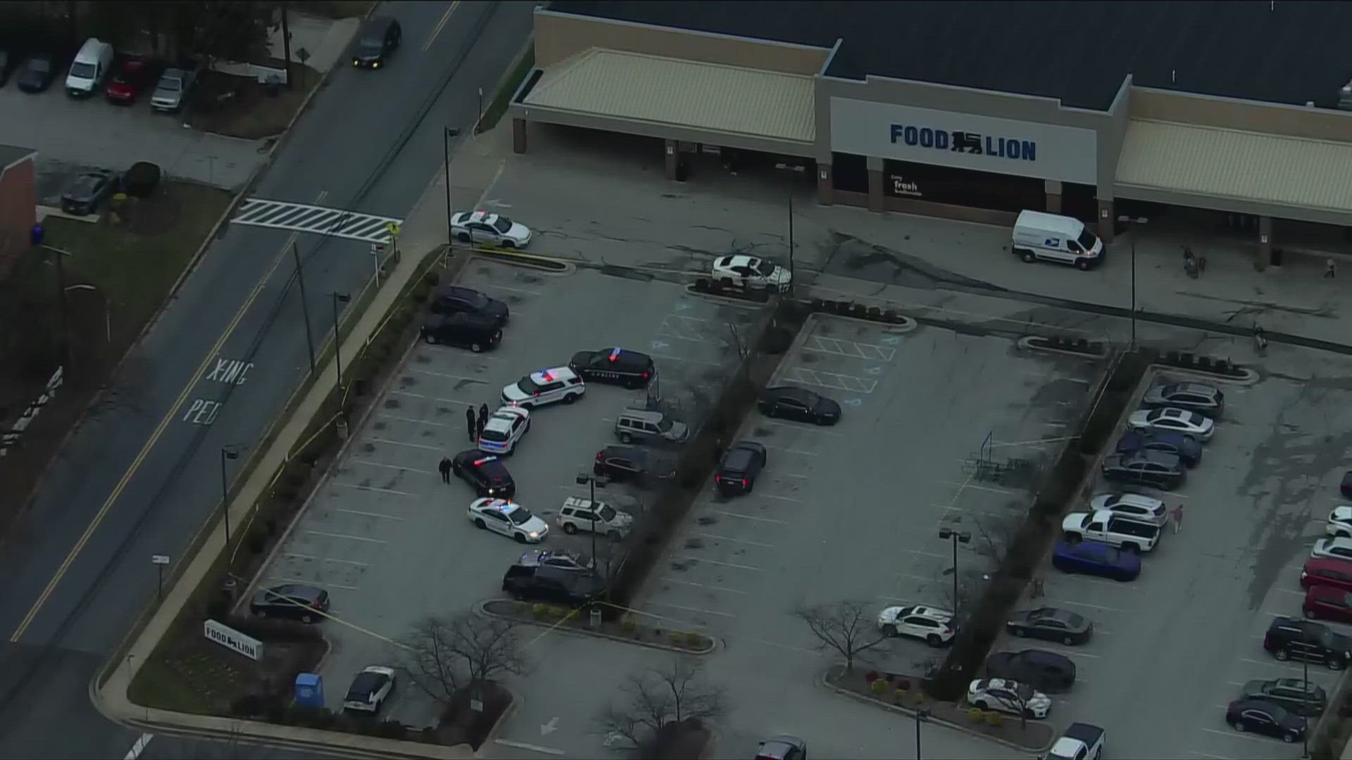 When officers arrived they found an older adult woman laying in the parking lot of a Food Lion.