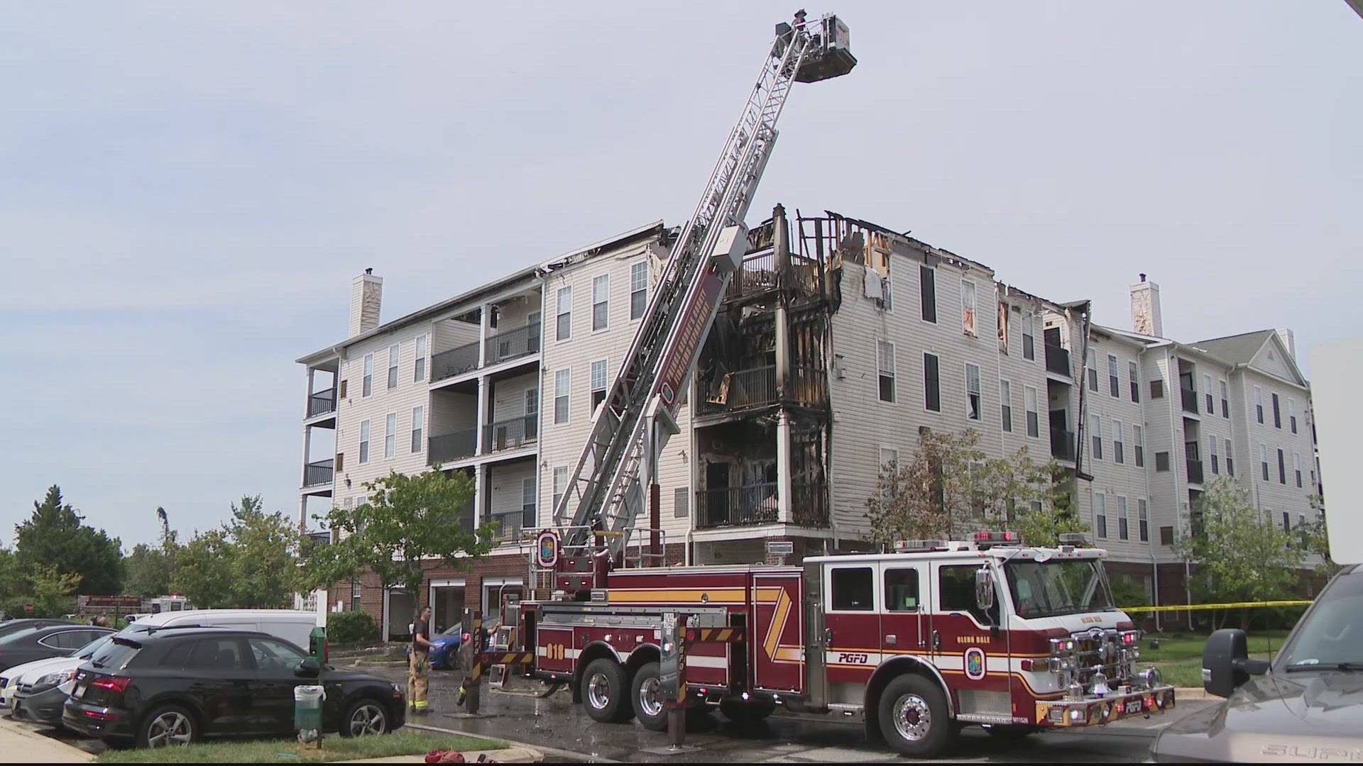 Flames could be seen shooting from the apartment building's roof Monday morning.