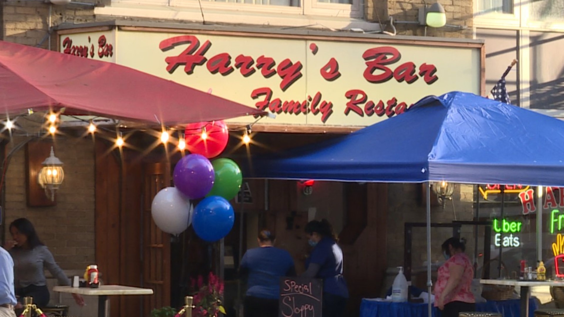 A video posted to Twitter Tuesday shows customers inside Harry's Restaurant cheering for a group of DC police officers. Many were maskless or standing at the bar.