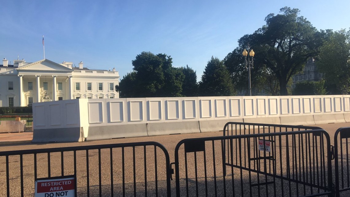 Construction starts on taller White House fence, giant panels block
