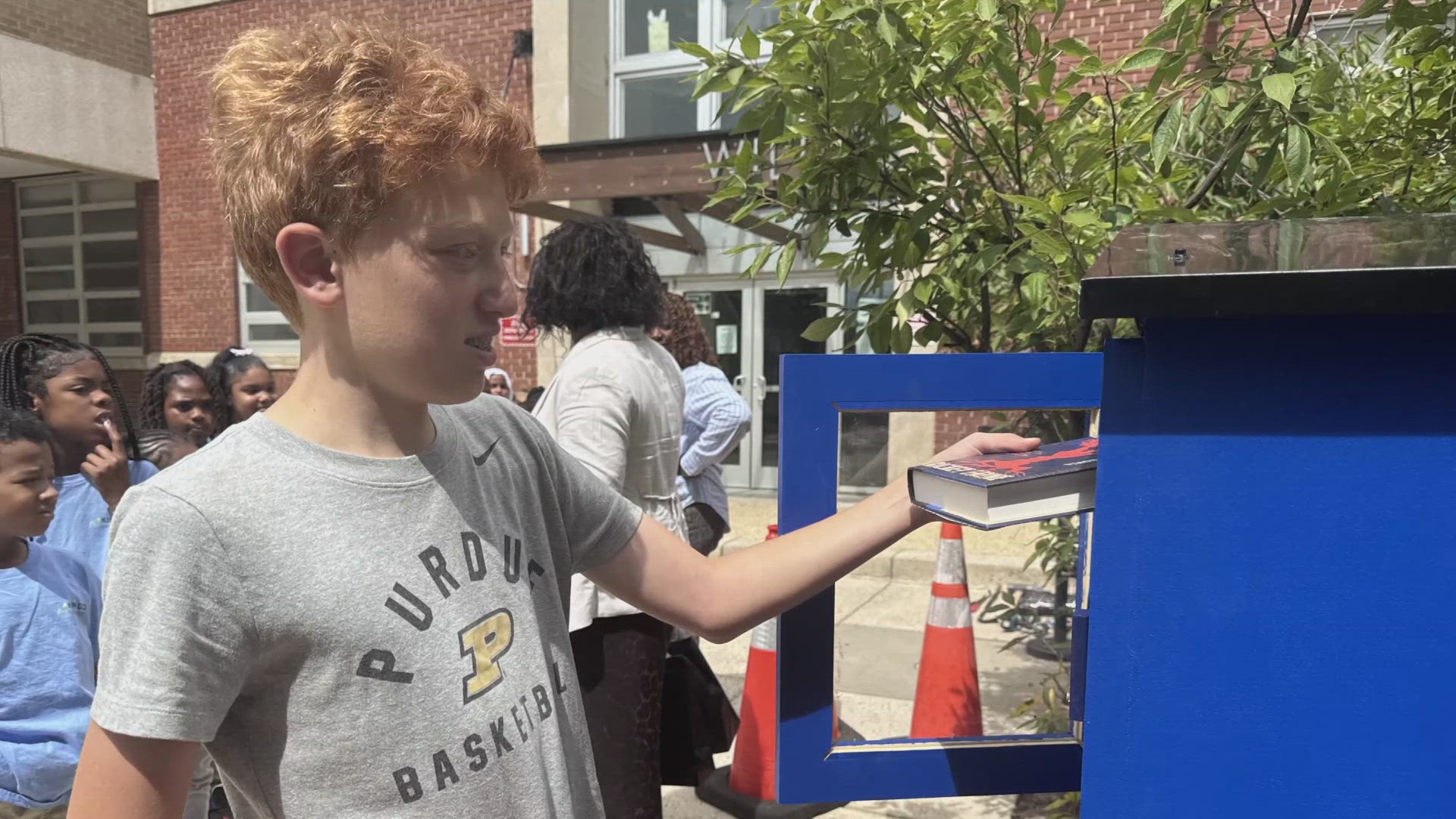 A local boy and his classmates are providing books to the community through a little free library.