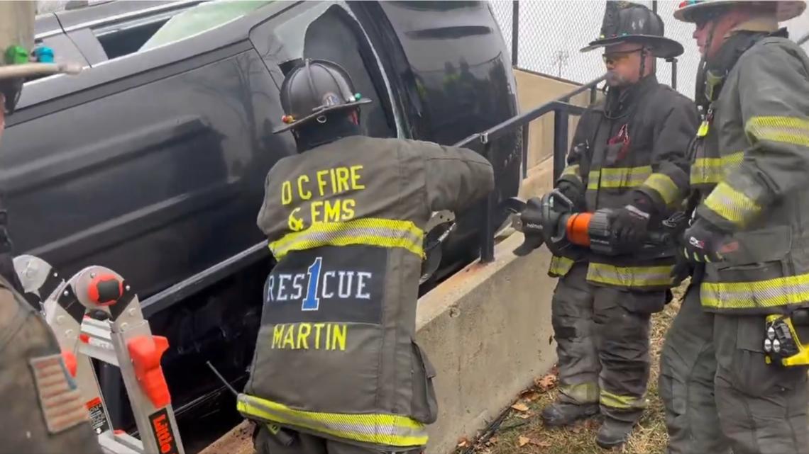 Man rescued from car flipped on rec center steps