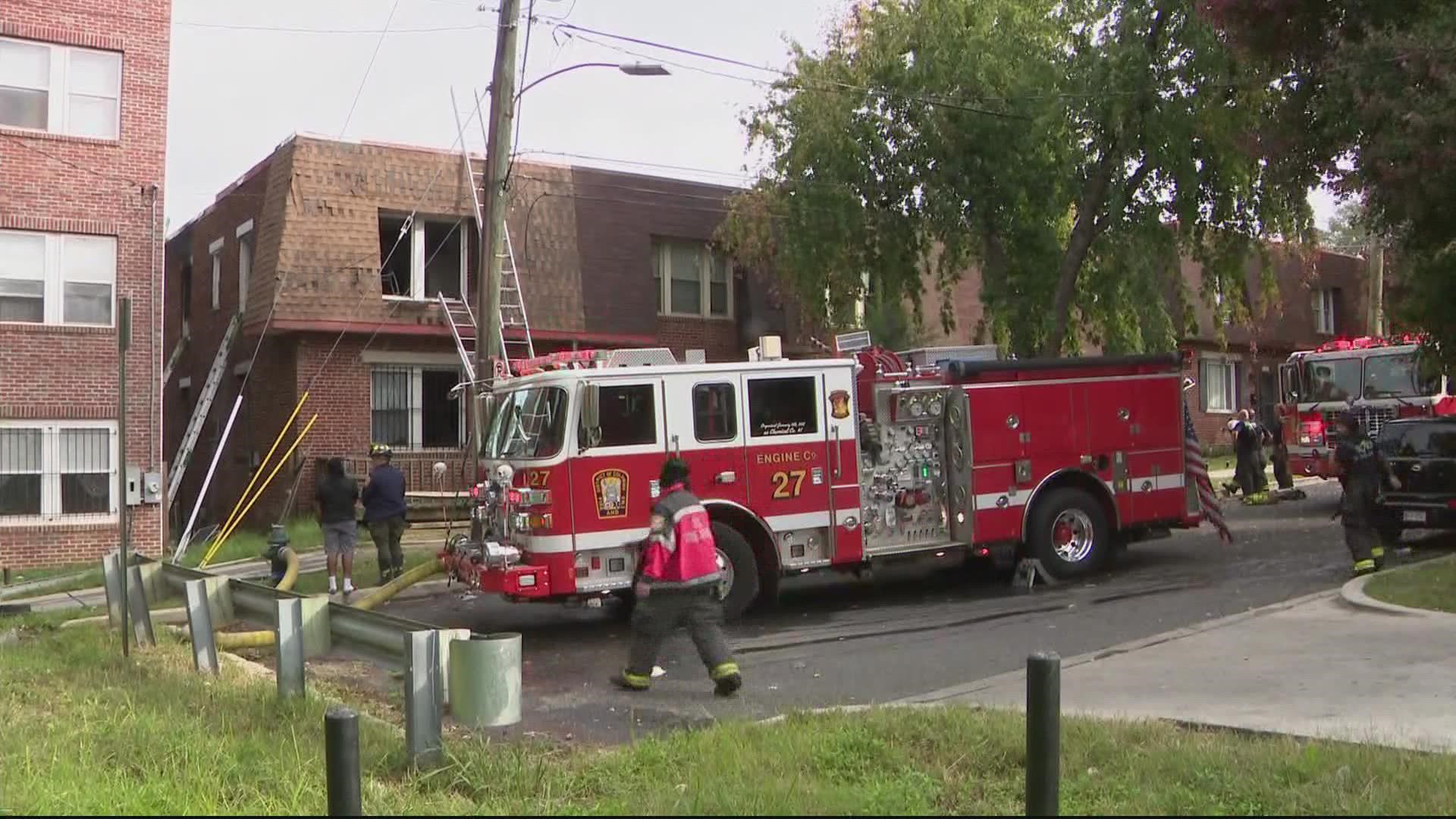Firefighters are on the scene of a house fire in Southeast D.C. that has displaced 13 people, including 11 children.
