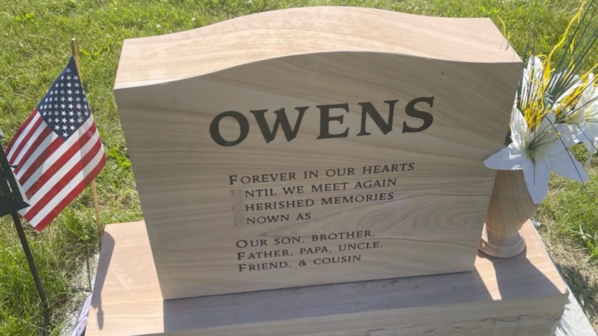 The community is preparing legal action to have the message removed from the headstone.