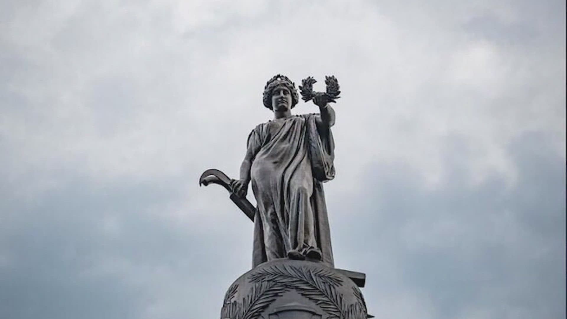 Work to remove the memorial had begun Monday before the restraining order was issued, but the memorial remains in place on cemetery grounds.