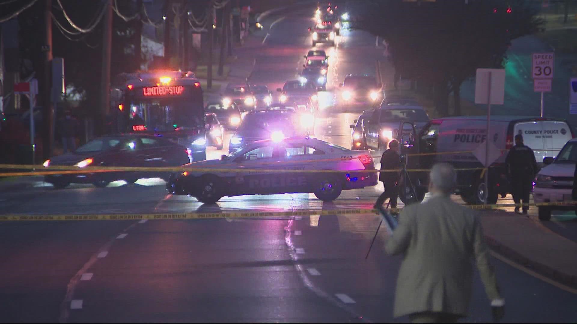 PG County police say officers investigating a crash found two men shot to death early Wednesday morning. They believe the victims were shot by someone else.
