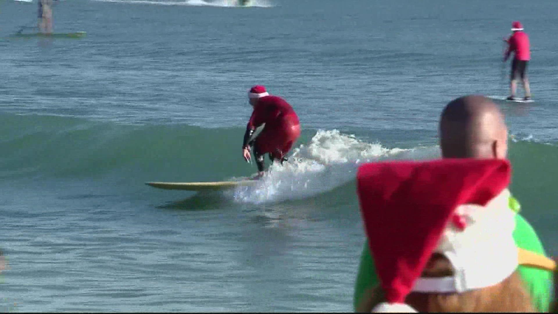 For the surfing Santas off Florida's central coast, the Atlantic Ocean felt more like the North Pole as temperatures on Saturday morning plunged to around freezing.