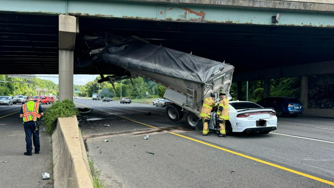 A truck trailer struck a bridge and a car on I495. A truck trailer struck a bridge and a car on I495.
