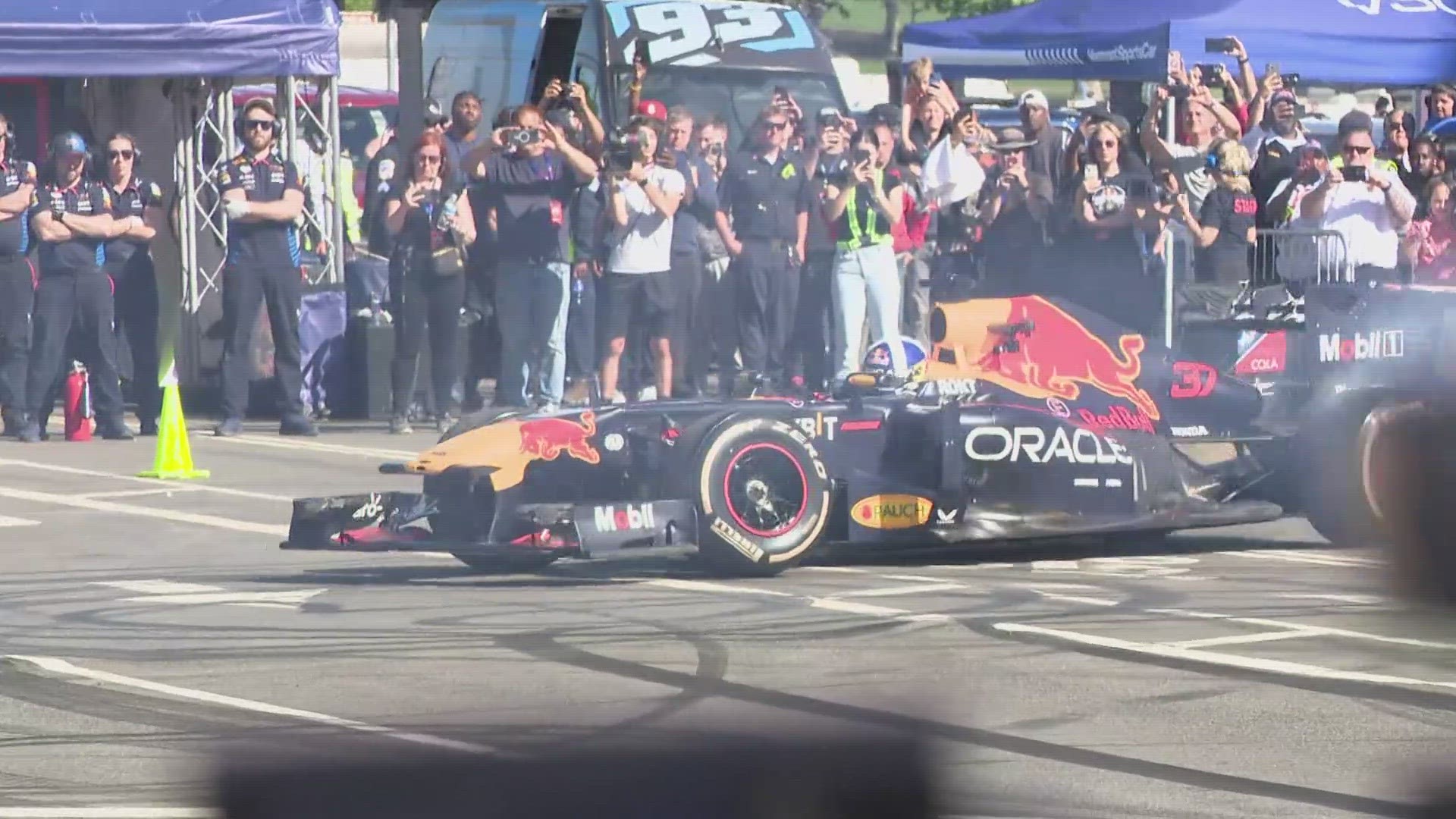 Fans gathered along Pennsylvania Ave. to watch a Formula 1 car roar down the street, Saturday evening as part of the Red Bull Racing Showrun in the District.