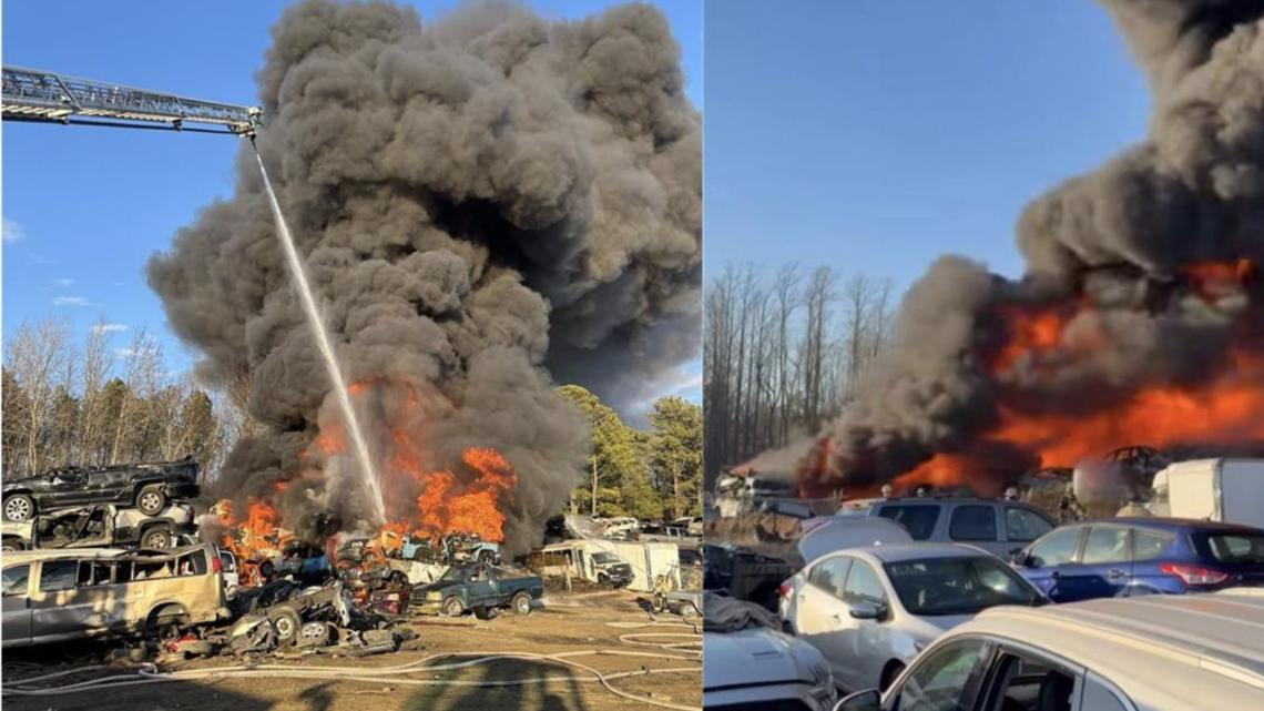 Explosion at auto body yard destroys dozens of cars