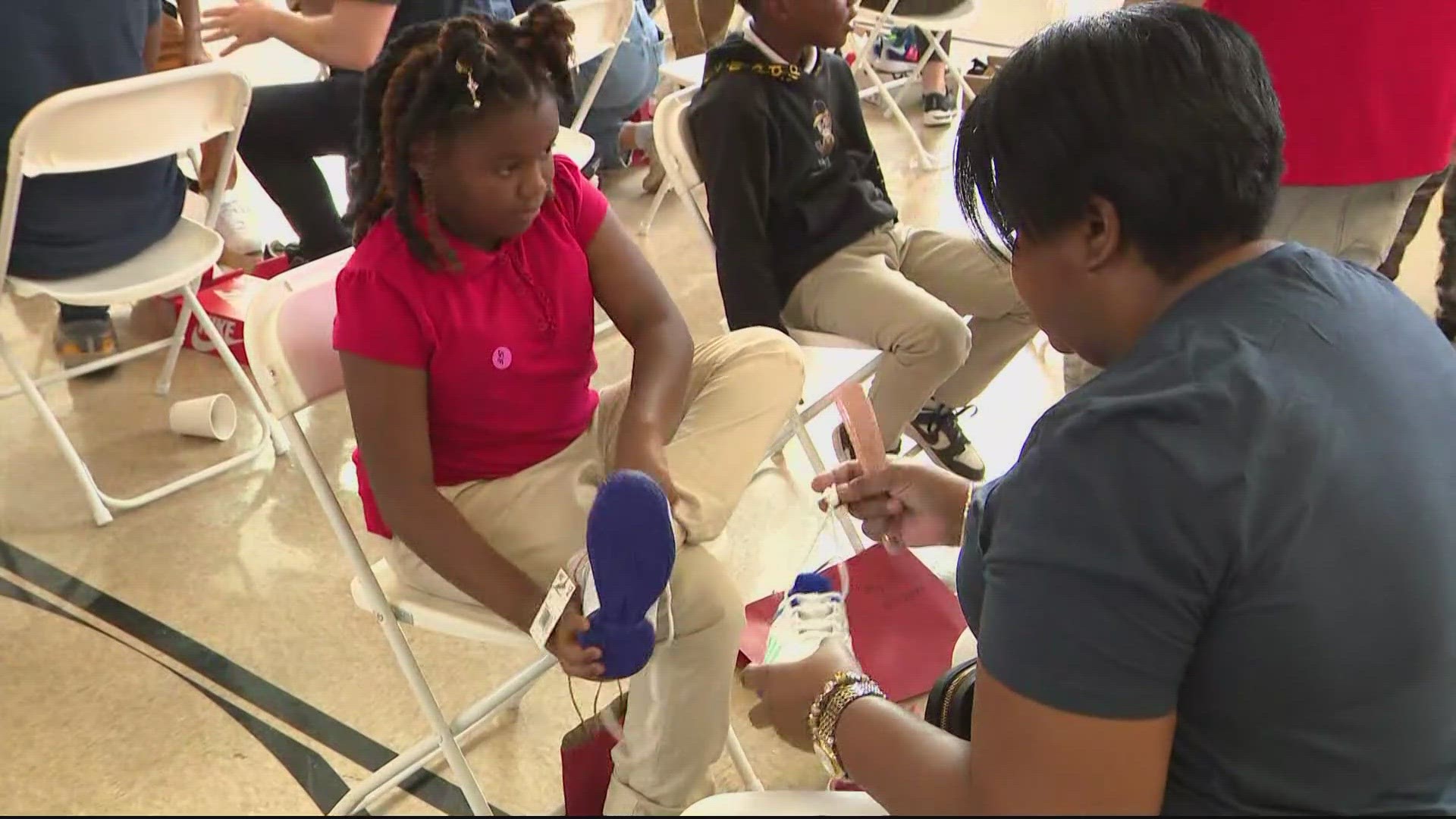 OVER 300 KIDS IN THE DISTRICT WERE SIZED, AND WALKED OUT THE DOOR WEARING A NEW PAIR OF SHOES.