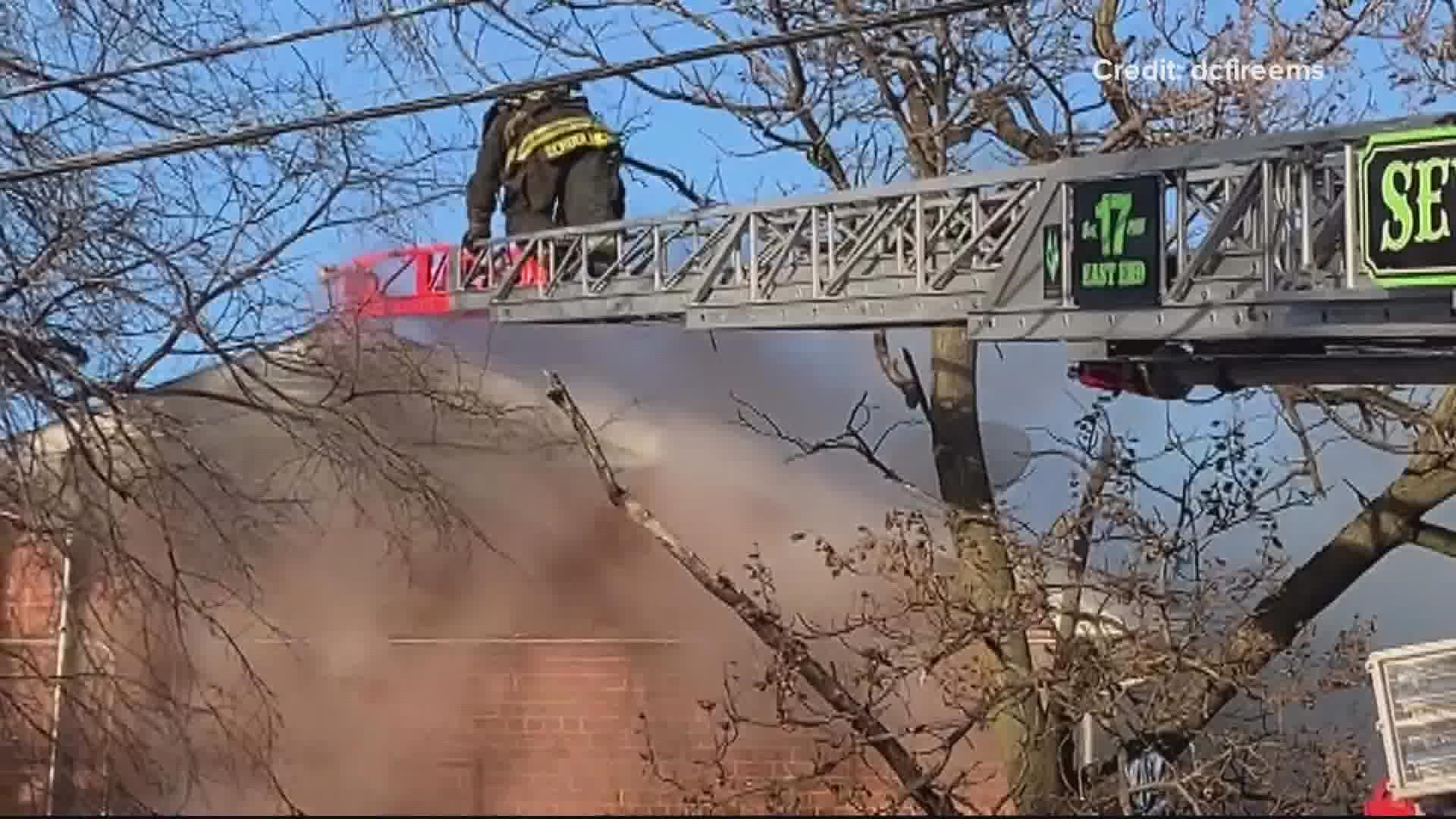 Both police and firefighters were called to respond to a person barricaded in a home in DC, that home then going up in flames.