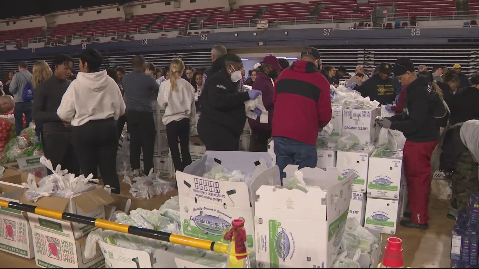 More than 700 volunteers packed thousands of boxes of food Saturday at Stadium Armory.