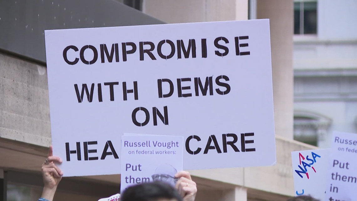 Government workers rally with lawmakers challenging federal firings during shutdown