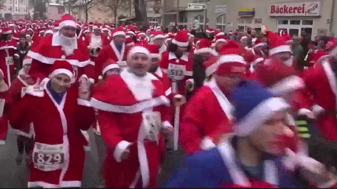 Thousands of runners dressed like Santa brave the cold to participate in 'Father Christmas' run
