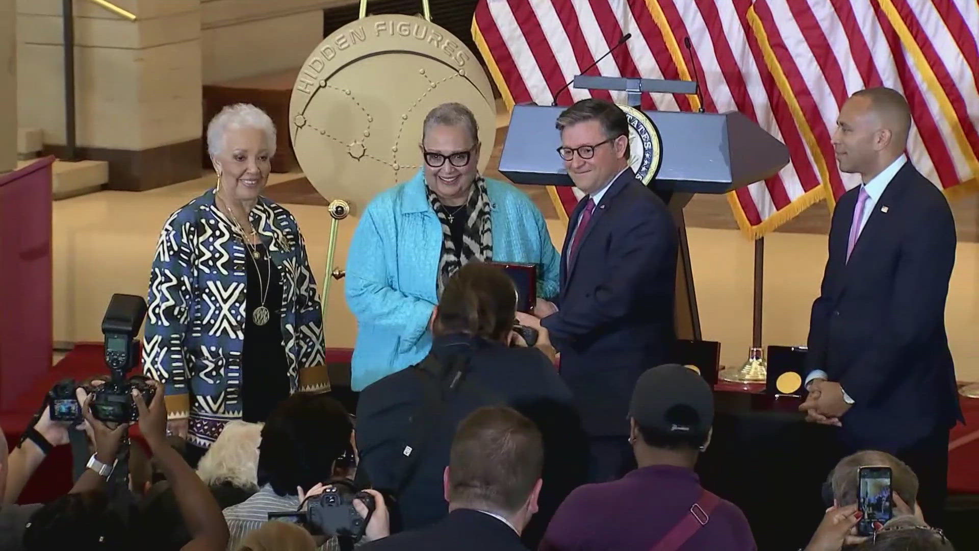 Relatives accepted on behalf of the late Mary Jackson, Dorothy Vaughan and Katherine Johnson. Christine Darden watched the ceremony from home.