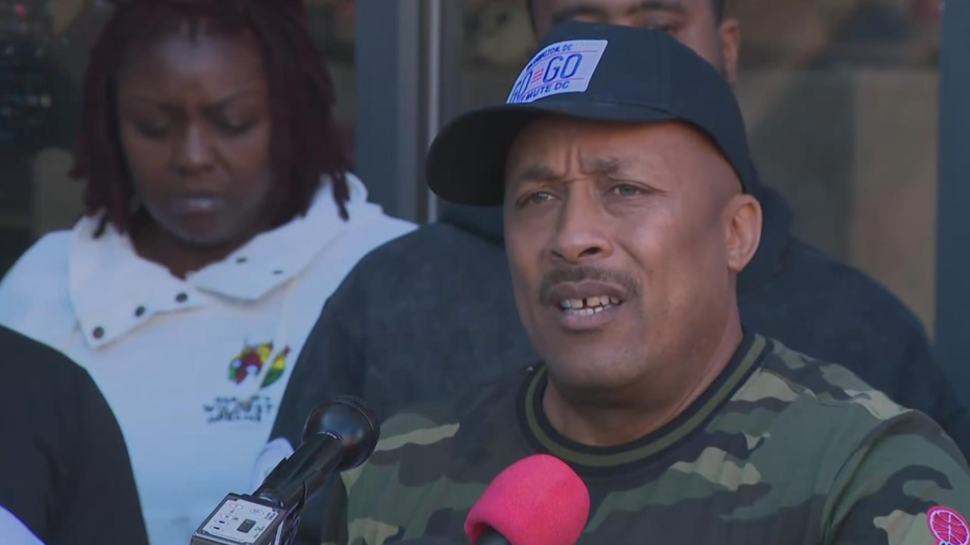 Community members unite outside &Pizza on U Street to demand respect for Mayor Marion Barry’s legacy amid the controversy over “Marion Berry Knots.