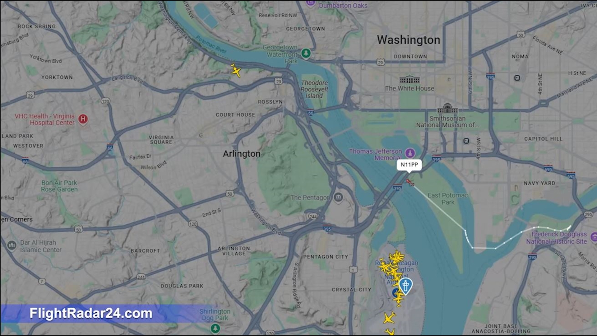 A police helicopter conducting a search on the George Washington Memorial Parkway forced three flights to make a second approach at Regan National Airport on Sunday.