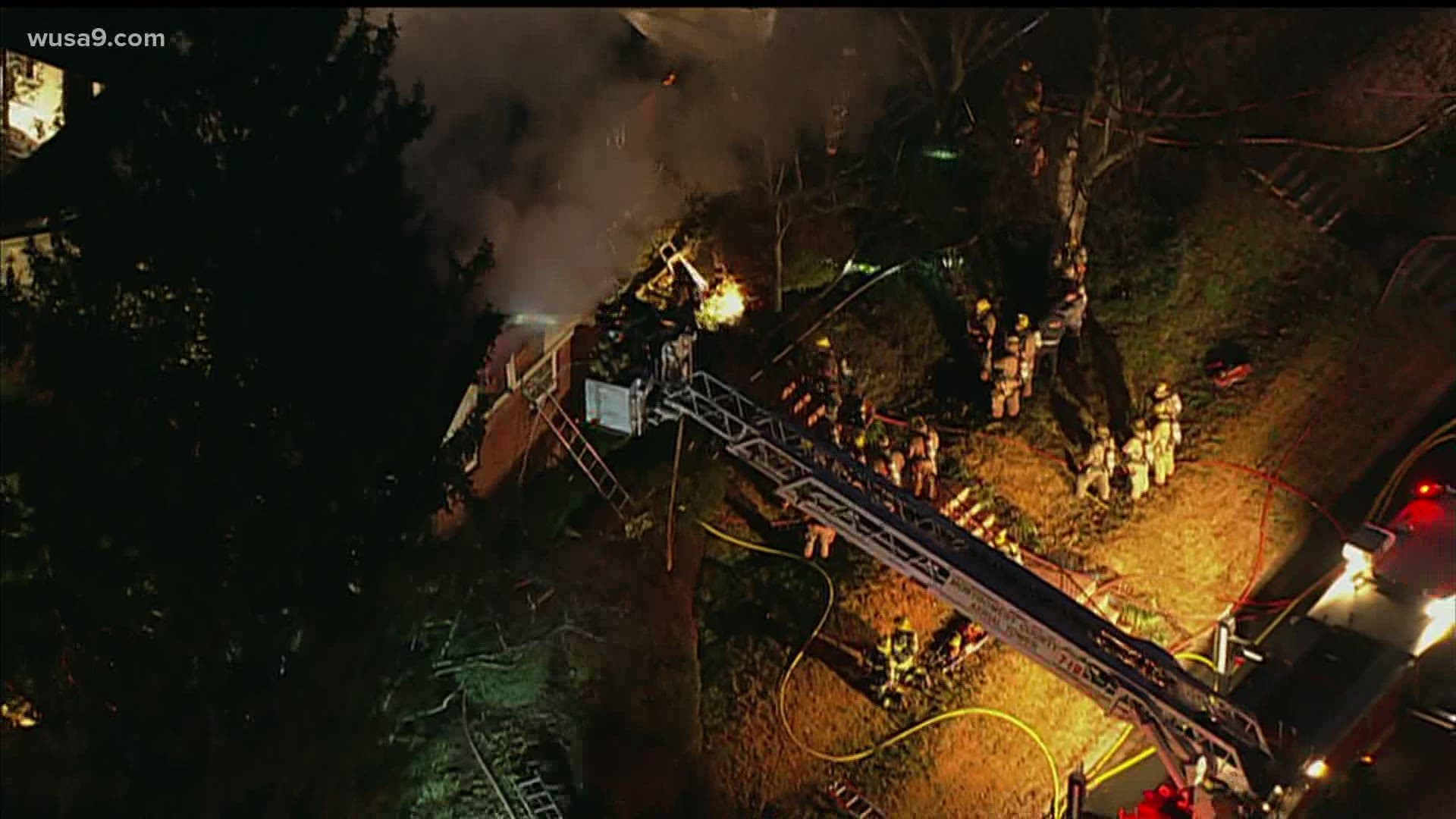 The Montgomery County Fire Department says two firefighters fell through a floor while battling the blaze.