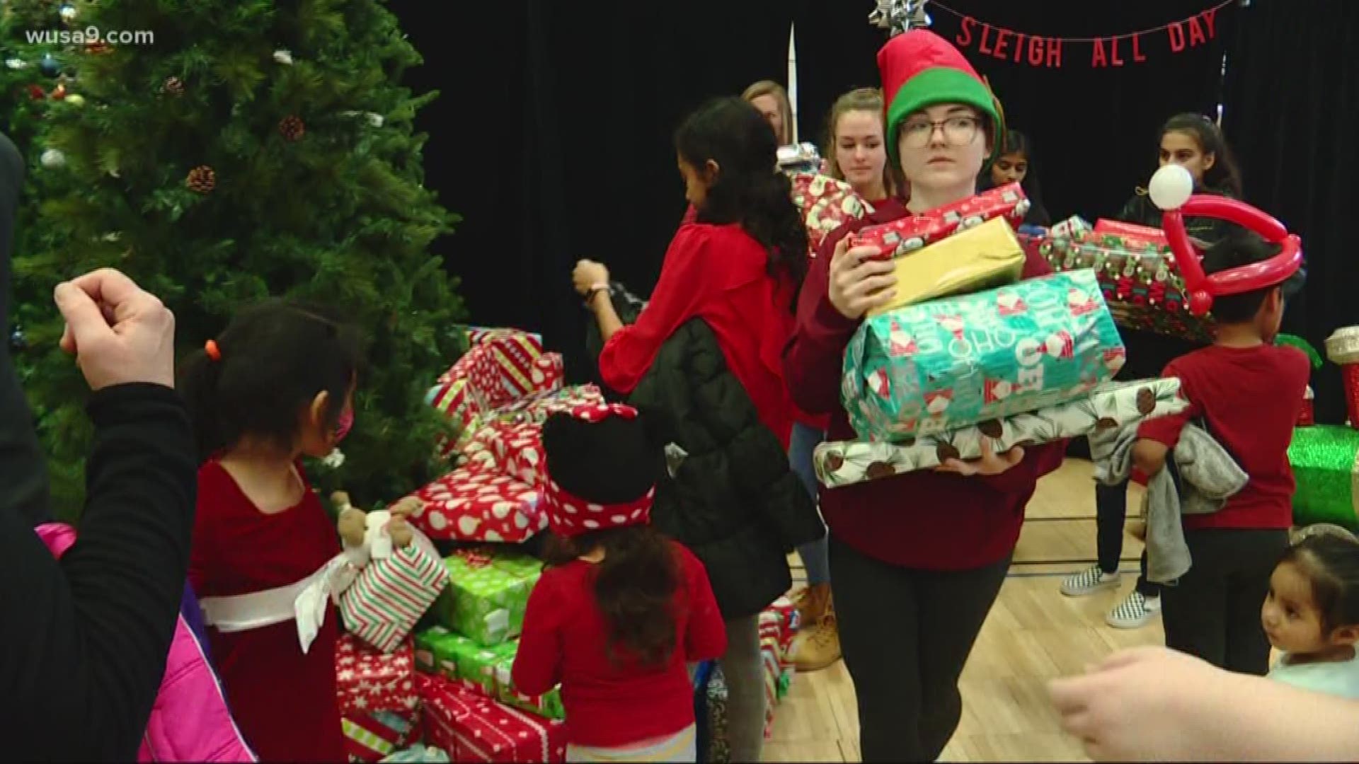 The Douglass Community Center in Leesburg was transformed into a winter wonderland Saturday - filled with stacks of gifts for each of the more than five hundred families who turned out.