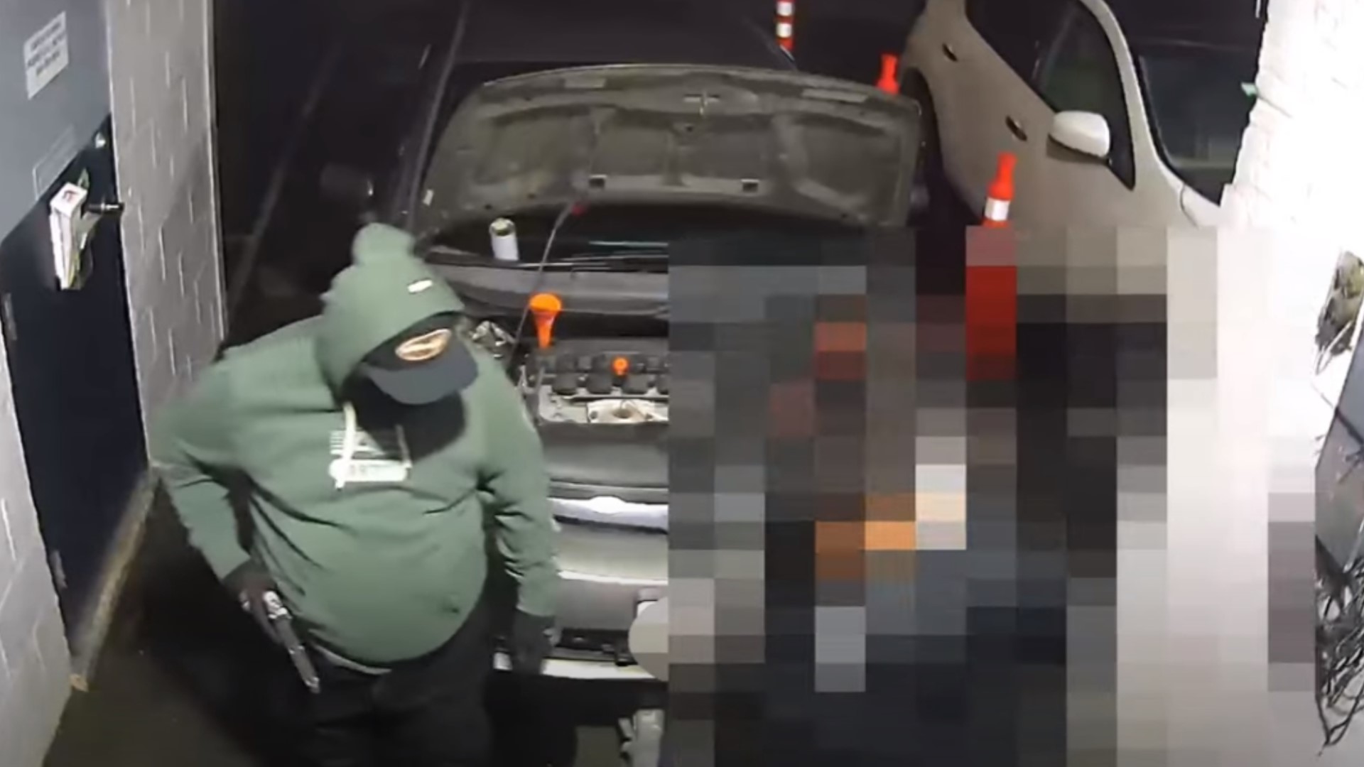 In the video, the suspect walks up to the men and asks how things are going before pulling a large gun from his waistband.