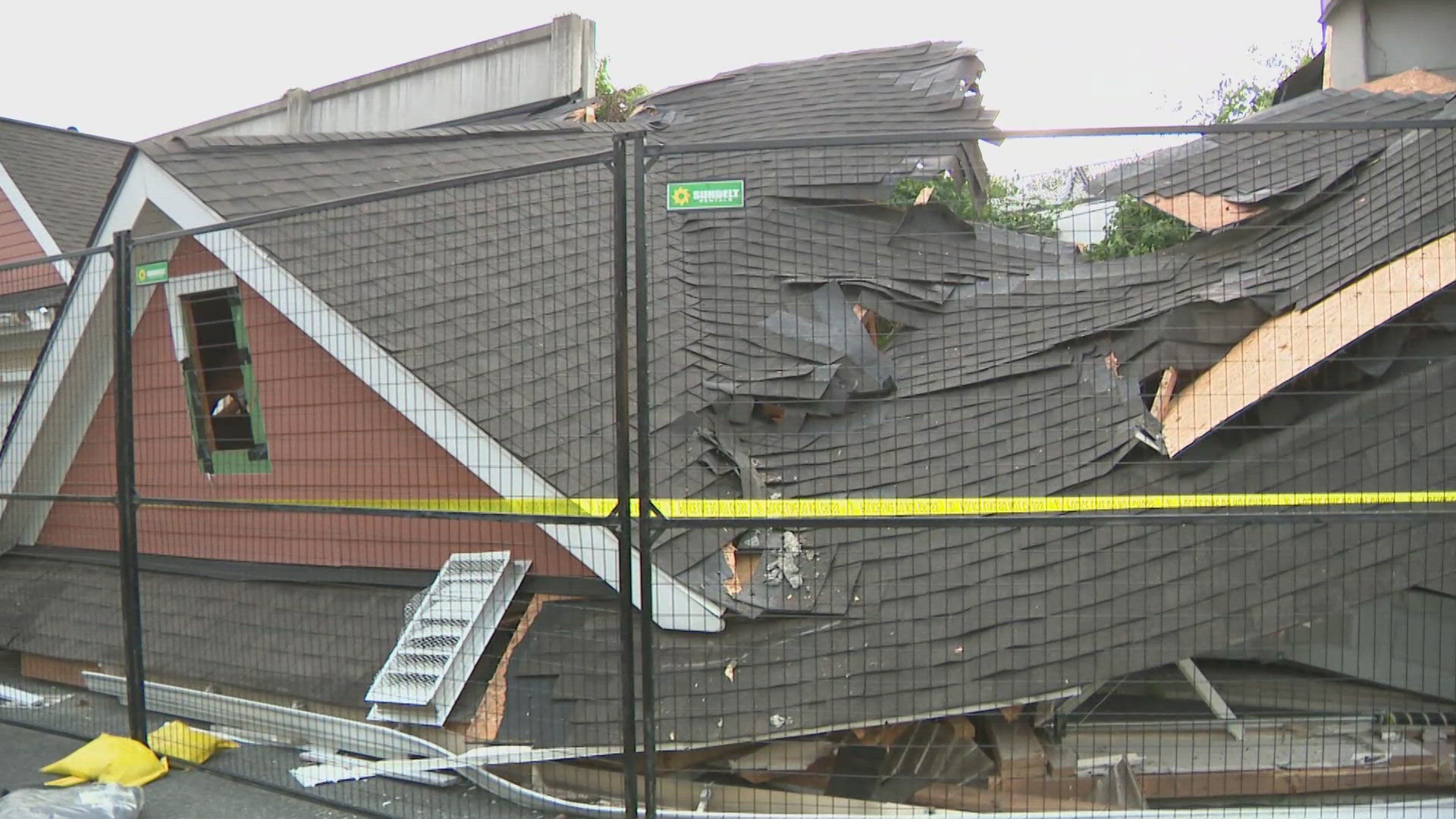 Officials say at least five cars derailed and crashed into six garages at Cobblestone Square.