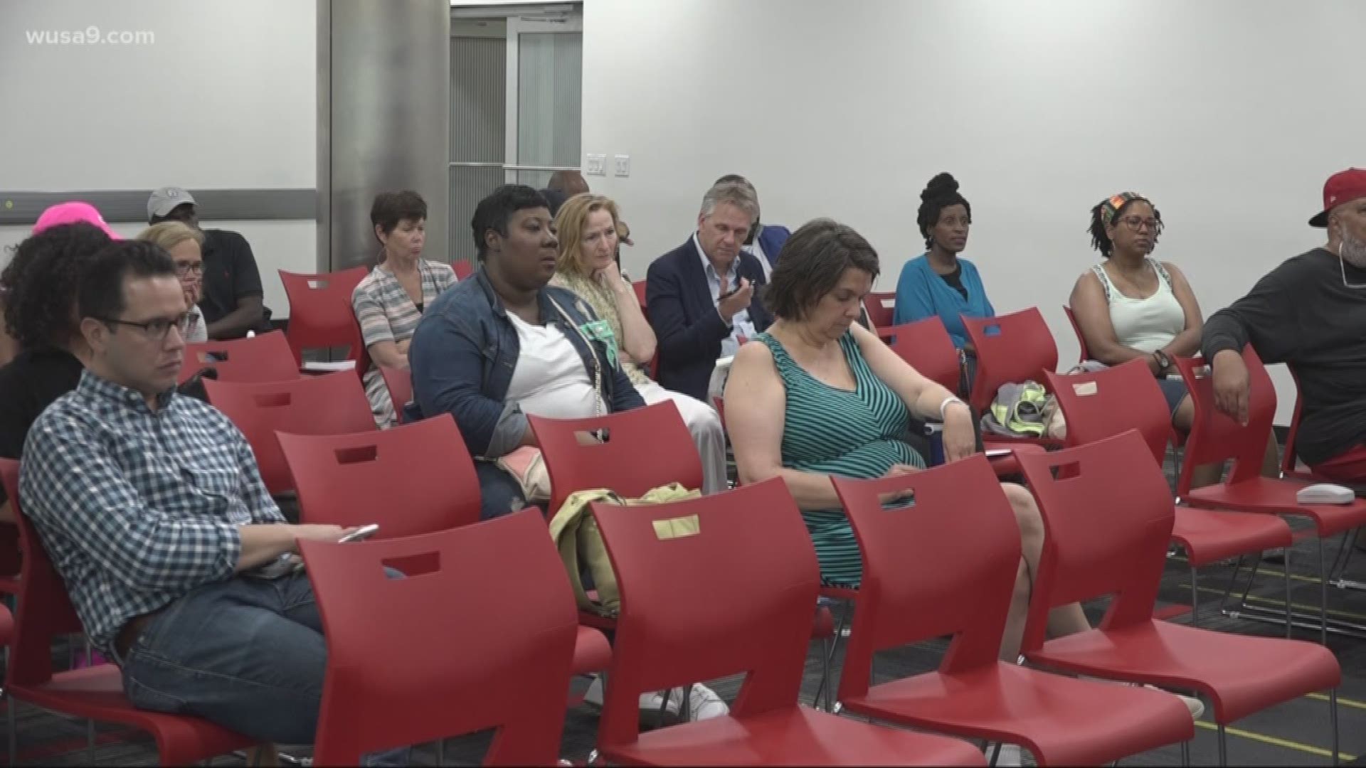 At the last community hearing to discuss Edmond's re-sentencing, members of the public debated whether the drug kingpin should be released from prison early.