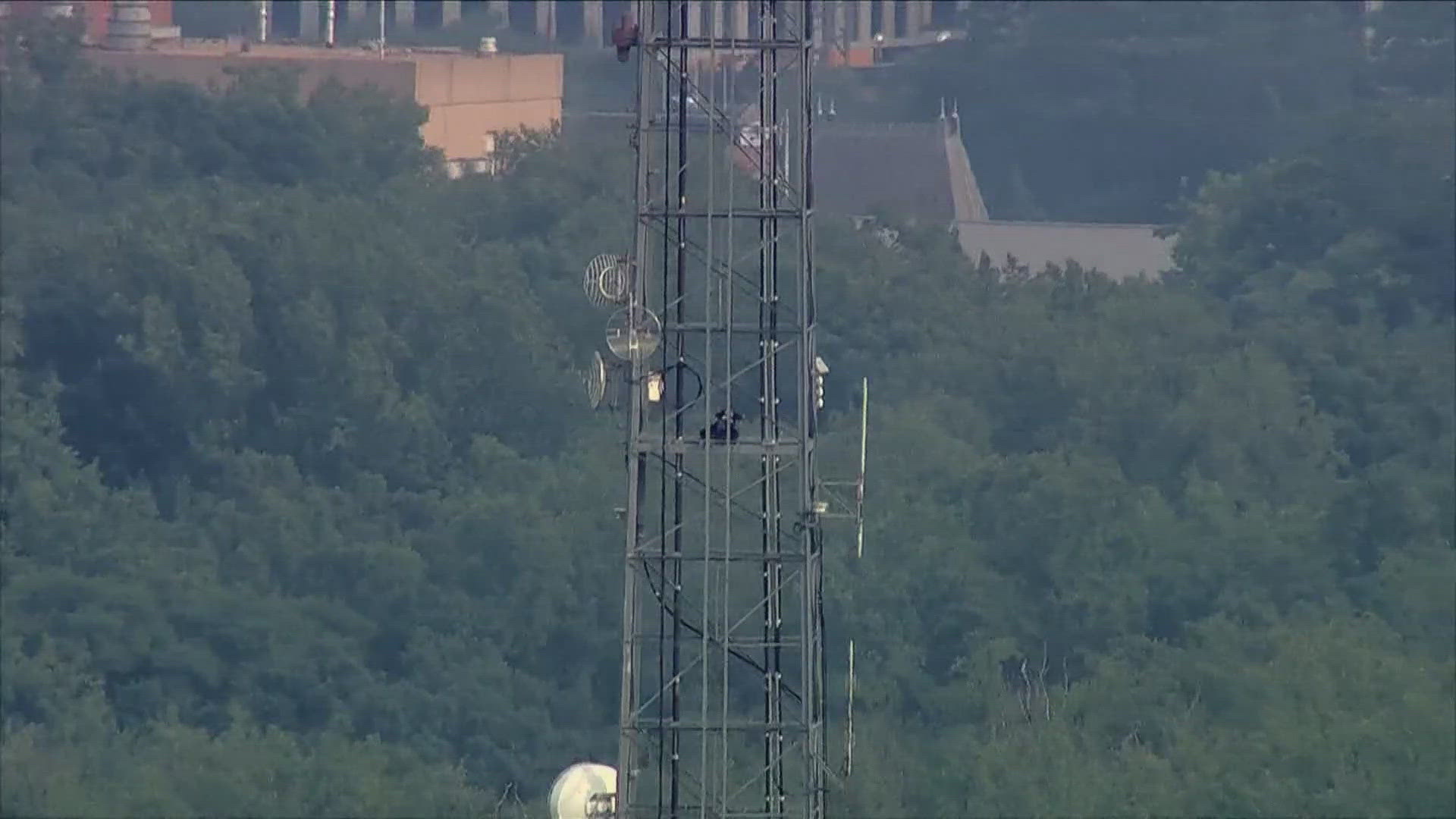It's been more than 30 hours since someone climbed up the radio and tower and have been refusing to come down.