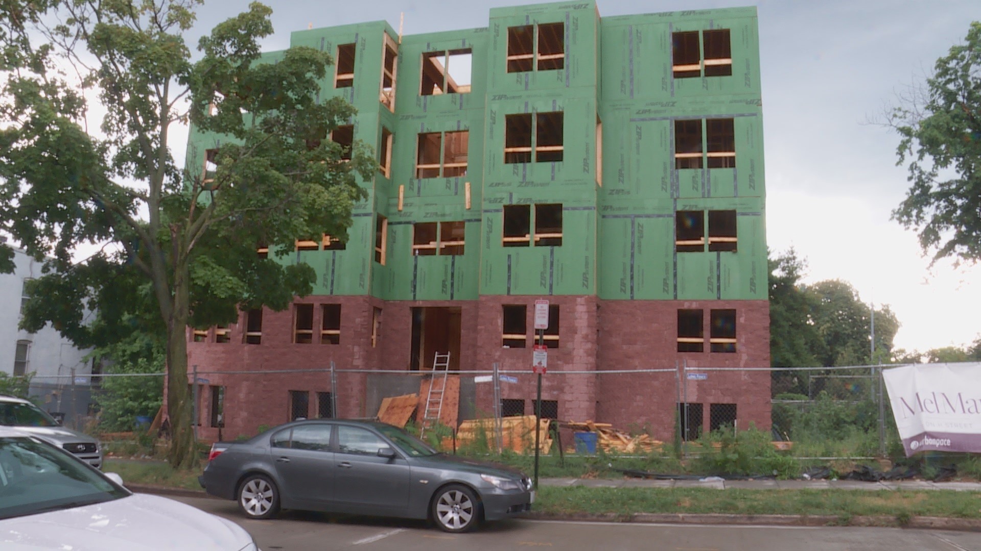 NE DC resident Corey Hamilton said construction material from an unfinished condominium project landed on his porch and car during a storm last week.