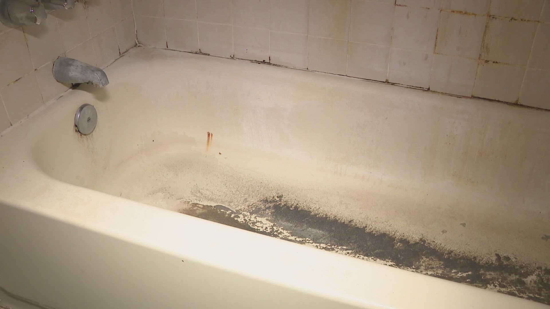 The overflow required removal of his carpet, caused wall damage, bathroom tub and sink damage as well as sanitation issues.