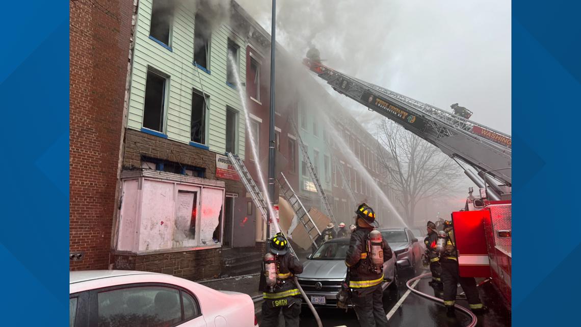 100 firefighters battle fire across buildings in Northwest; 3 hurt