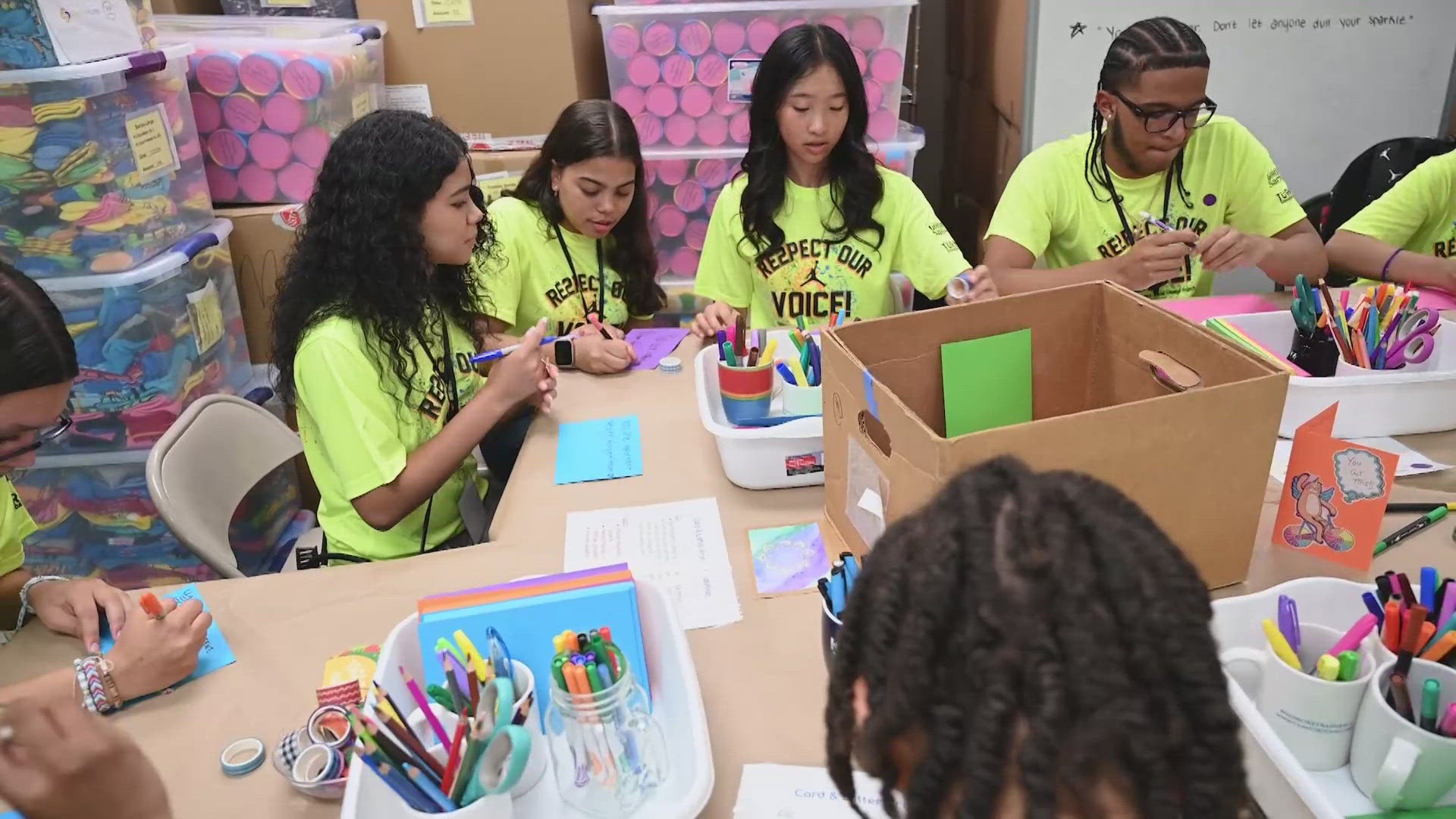 They are packing backpacks for kids in foster care.