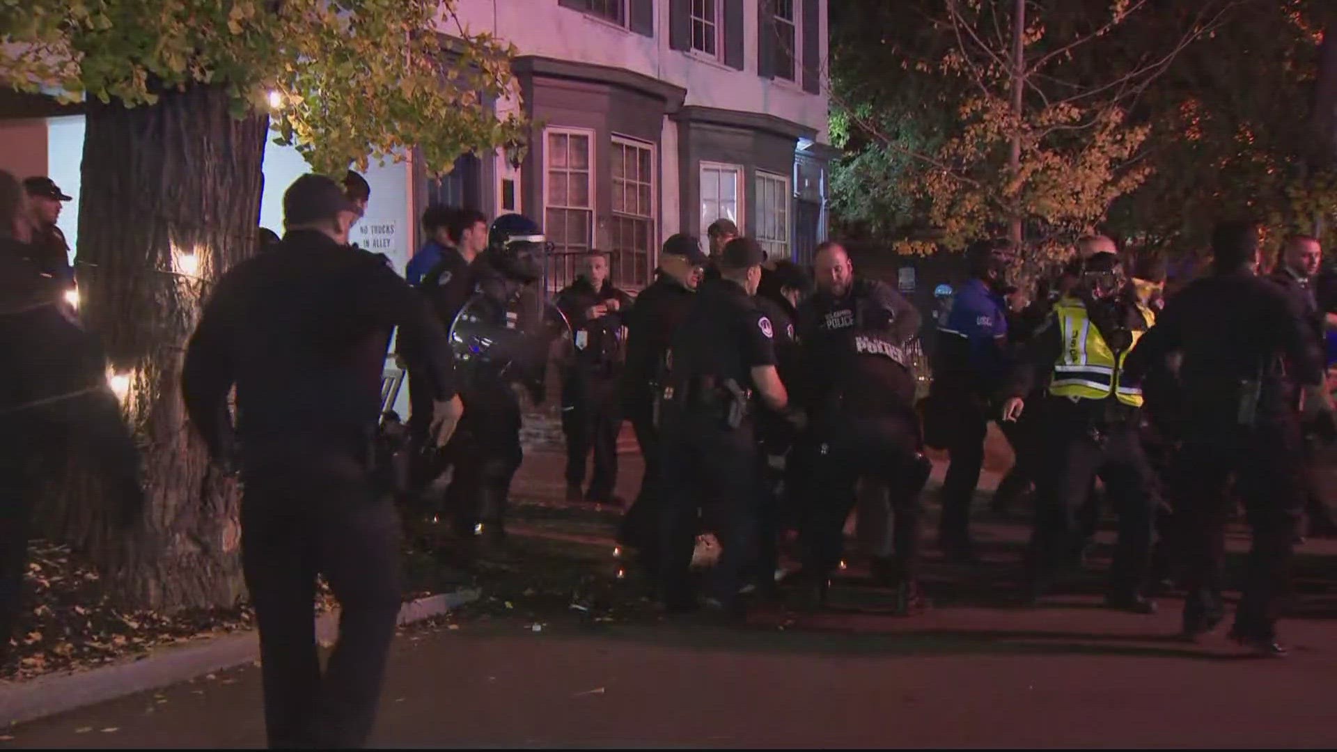 Officers pepper sprayed and punched at 'illegal' protest outside DNC