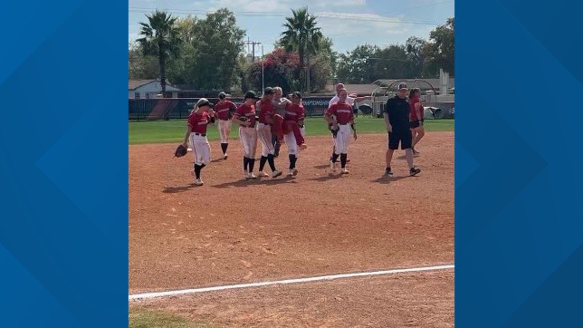 Softball team helps injured player around bases for grand slam