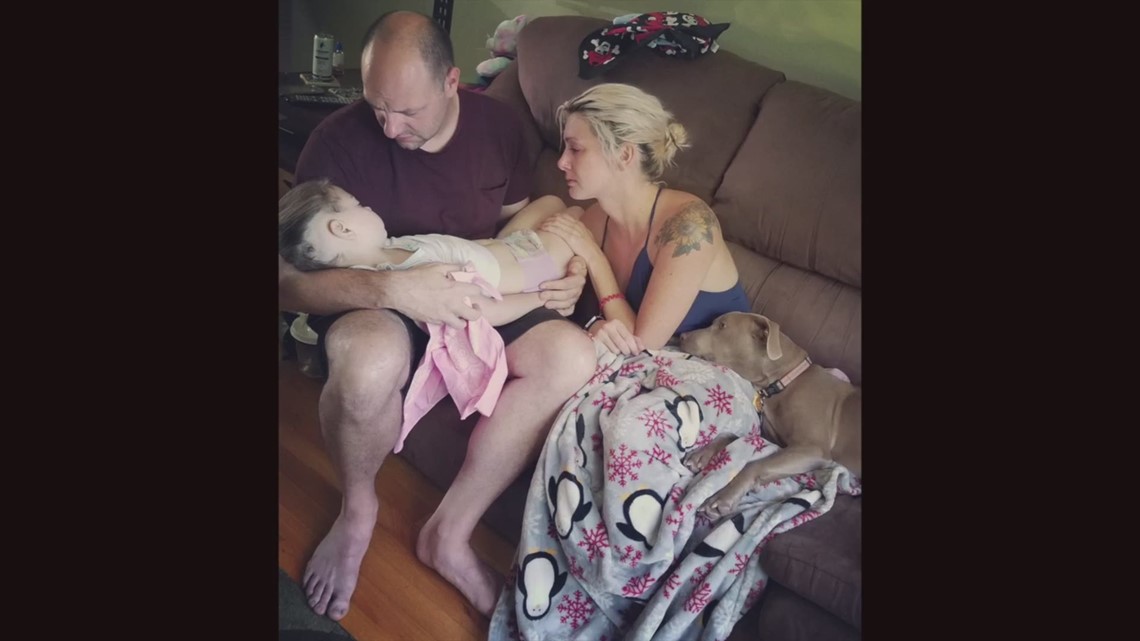 Parents Share Powerful Photo Holding Their Daughter In Final Moments