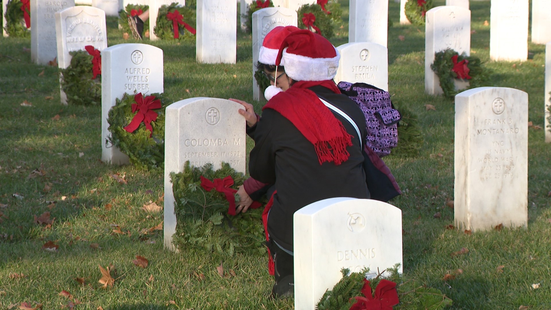 Volunteers laid more than 200,000 wreaths to honor those laid to rest at Arlington National Cemetery as part of Wreaths Across America Day.