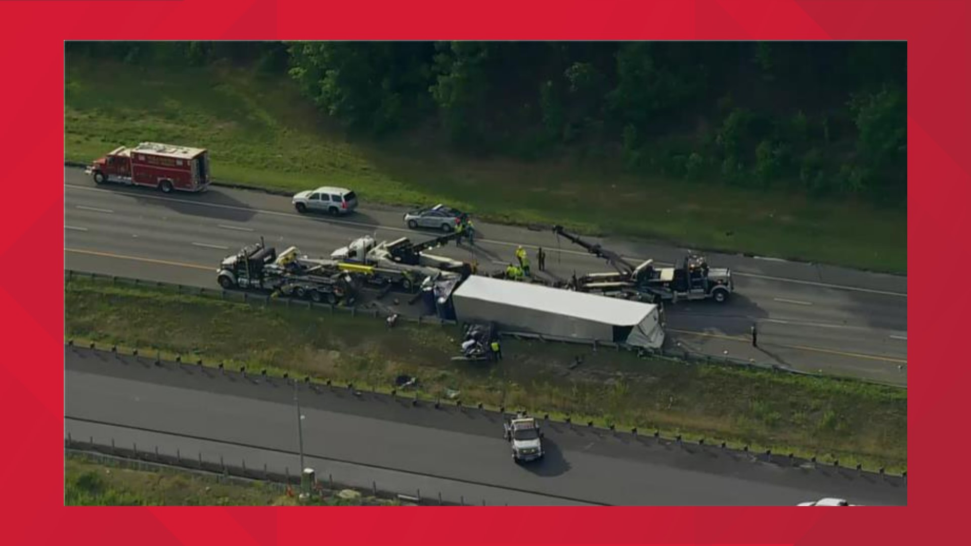 Two people were killed and one person was injured after a multi-car crash involving an overturned tractor-trailer.