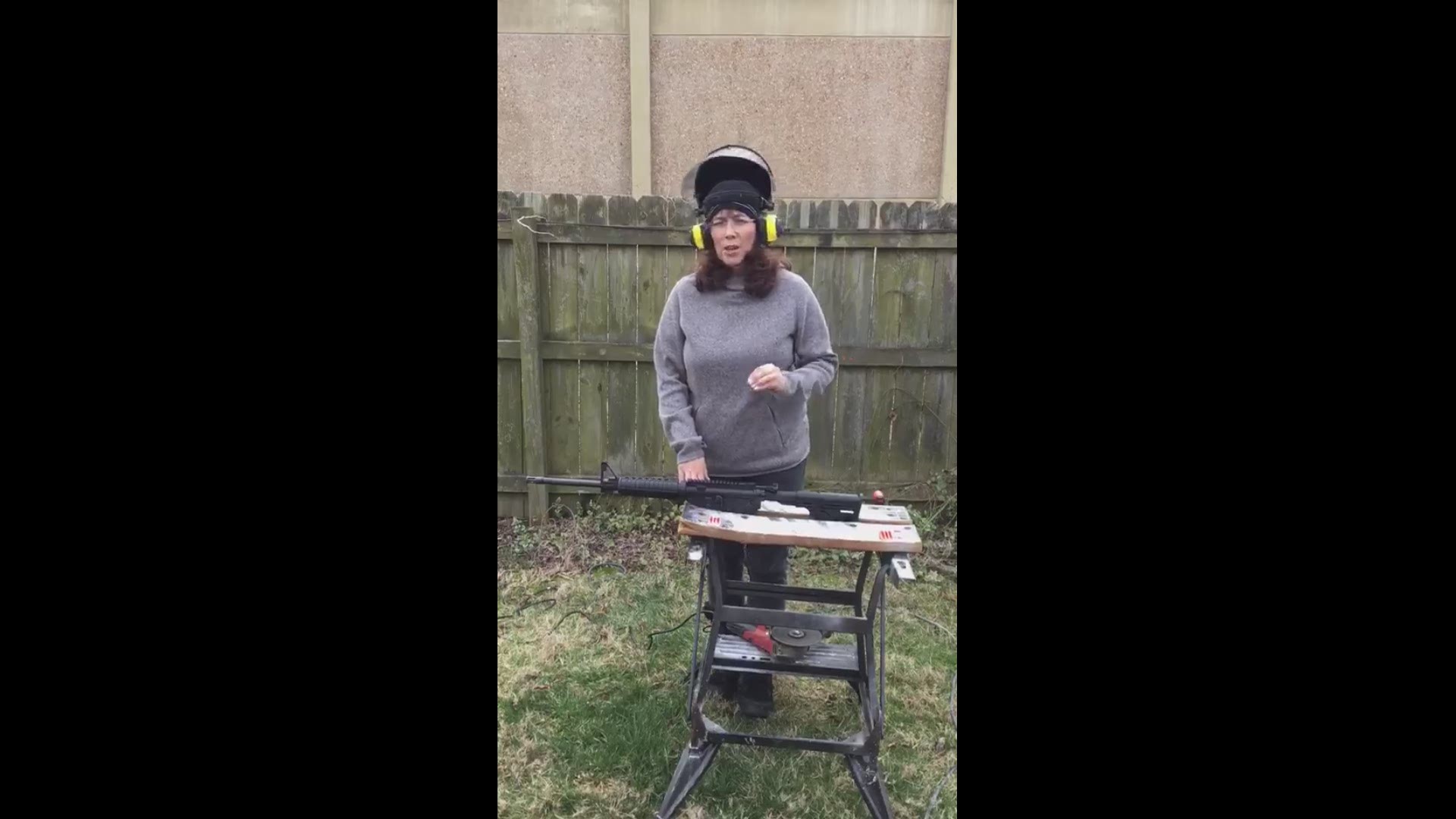 Democratic candidate for U.S. Congress Karen Mallard uses a saw to cut apart an AR-15 rifle. (VIDEO from Karen Mallard for Congress Facebook Page)