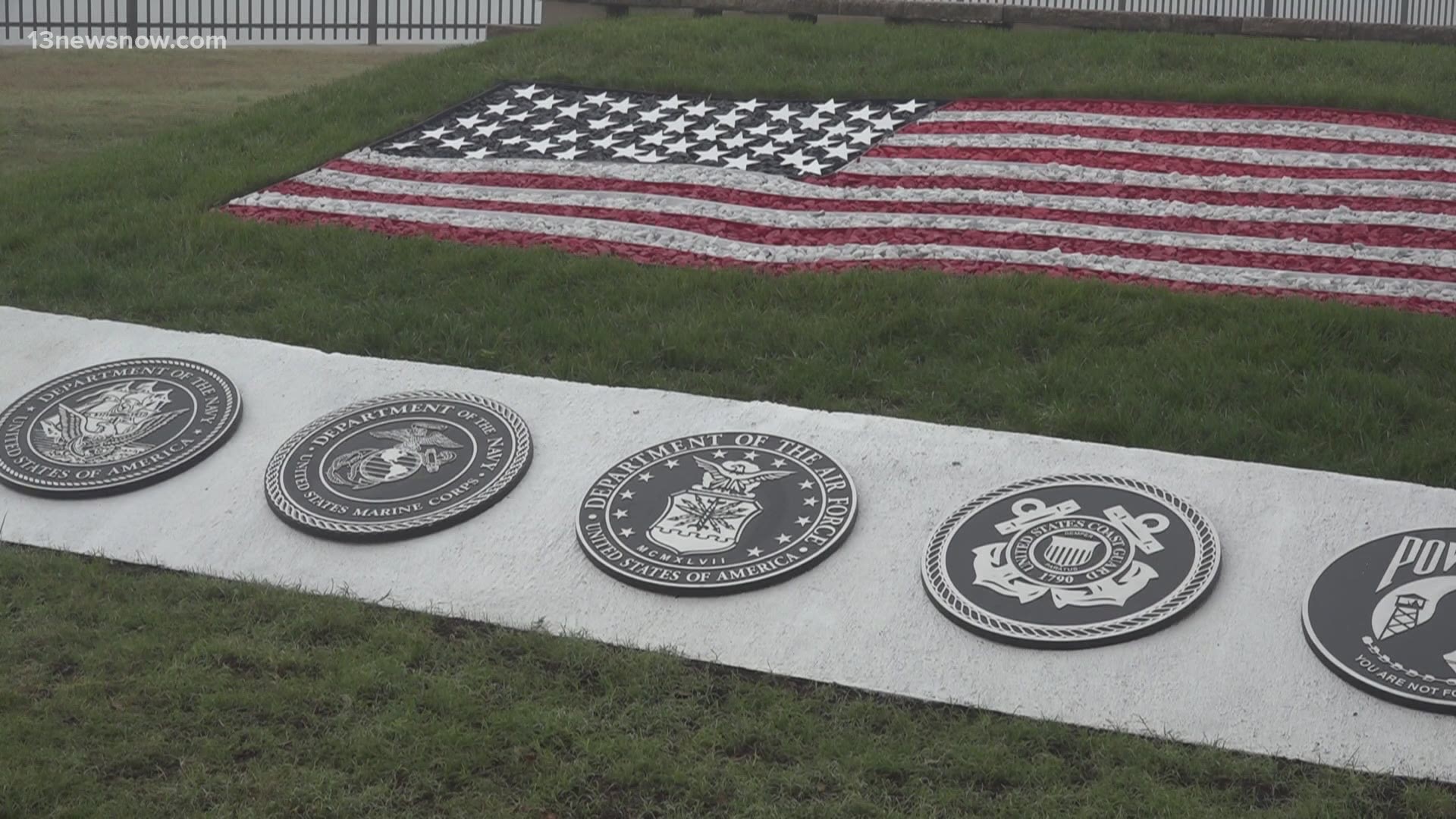 Employees dream up, then build a rock garden pillar to the American flag, service branches, and POW-MIA's.